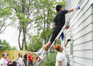 group cares painting a house